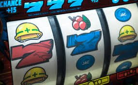 Filipino player aiming cannon at colourful fish targets in 3djili fish shooting game